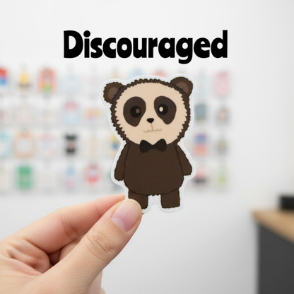 Cocoa - The dejected Spectacled Bear with Heterochromia Sticker